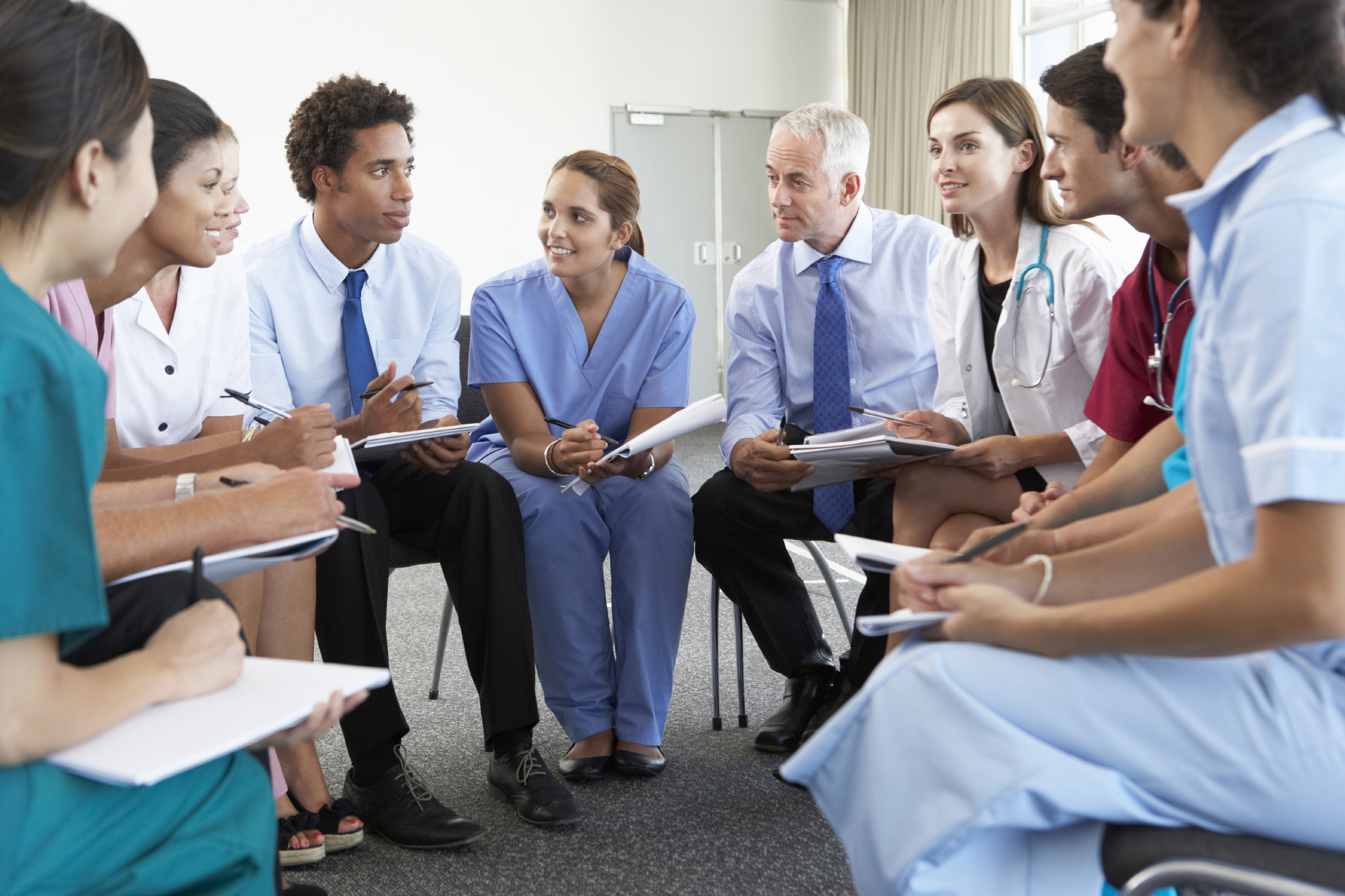Diverse hospital staff gathered together