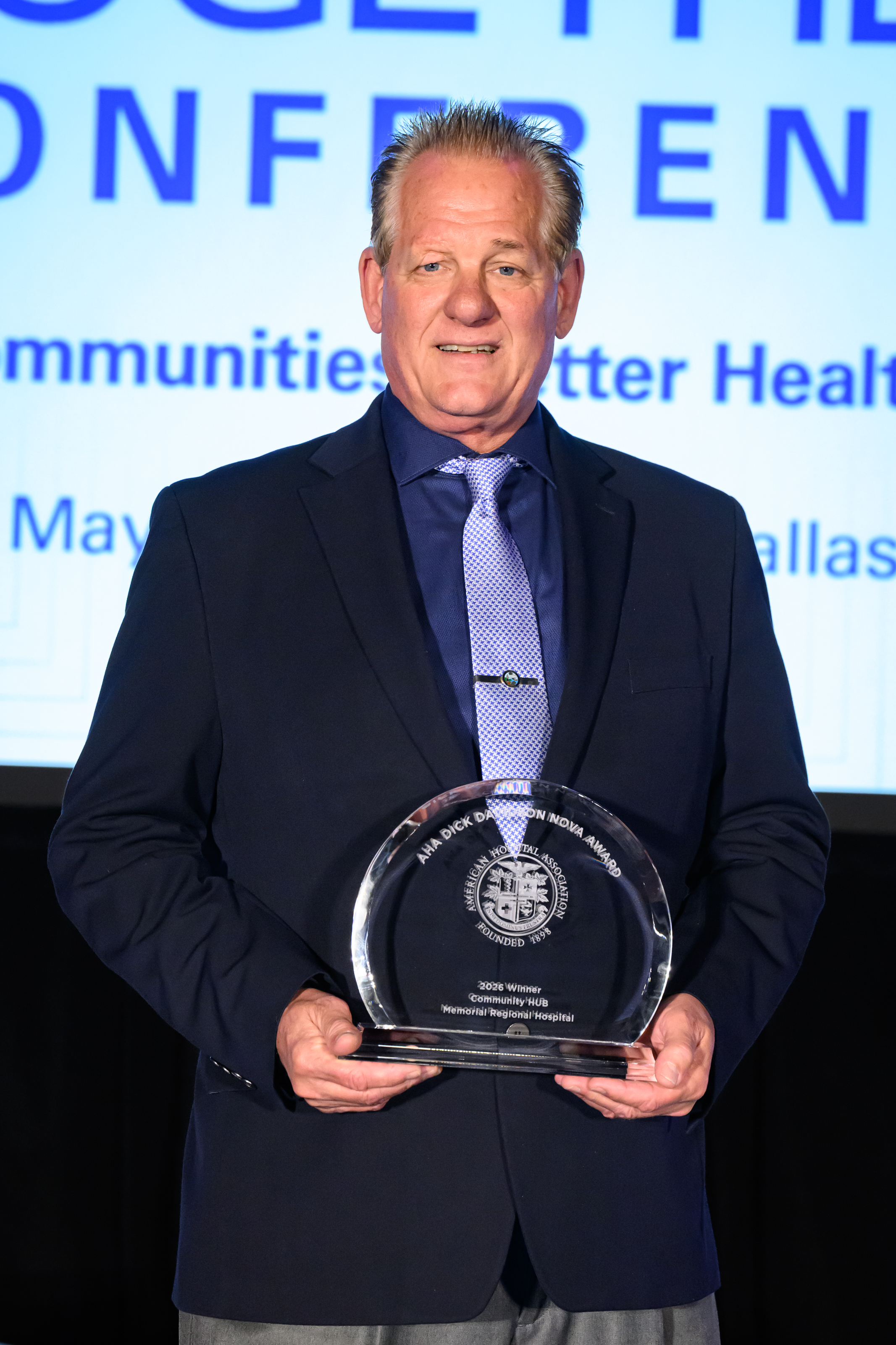 Memorial Regional Hospital accepts the 2026 Dick Davidson NOVA Award at the AHA Healthier Together Conference.