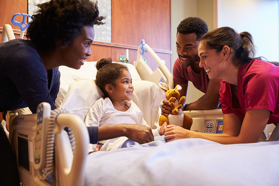 A diverse group of doctors and nurses treating a patient